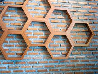 Shelves made of hexagonal wood on wall