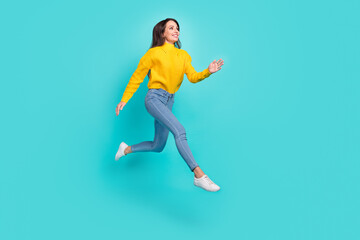 Fototapeta na wymiar Full length body size view of attractive cheerful purposeful girl jumping running isolated over bright teal turquoise color background