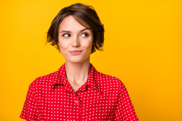 Photo of pretty funky young girl look interested empty space thinking isolated on yellow color...