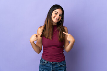 Fototapeta na wymiar Young caucasian woman isolated on purple background proud and self-satisfied