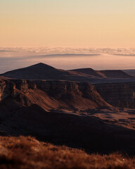 Naklejka premium Photography of the canyon in the morning. Beautiful sunrise and nature. Mountains above the clouds. Russian nature.