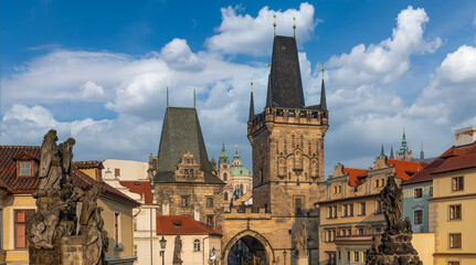 Fototapeta na wymiar Scenic view from the Charles Bridge to the domes and towers of the capital of the Czech Republic - the city of Prague