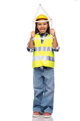 building, construction and profession concept - smiling little girl in protective helmet and safety vest with ruler in shape of house over white background