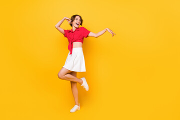 Fototapeta na wymiar Full body photo of crazy excited person look empty space have good mood isolated on yellow color background