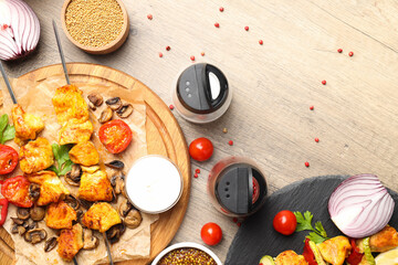 Concept of tasty food with chicken shashlik on light wooden background
