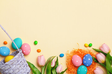 Easter composition on a beige background. Tulips eggs basket. Top view copy space flat lay