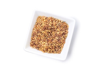 Bowl of buckwheat tea isolated on white background