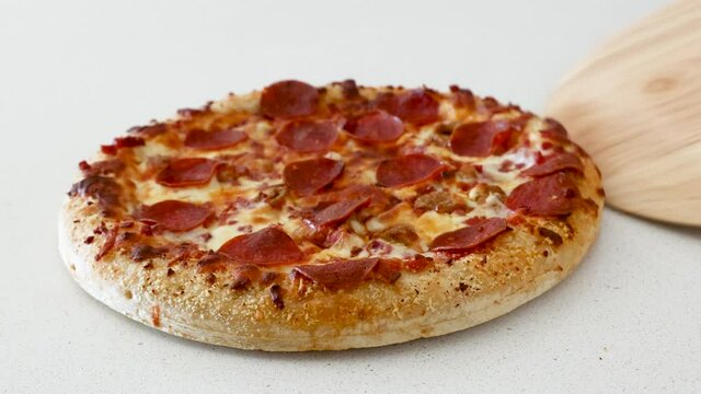 Serving a Pepperoni Pizza