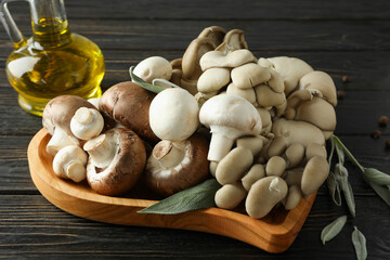 Concept of tasty food with mushrooms on wooden background