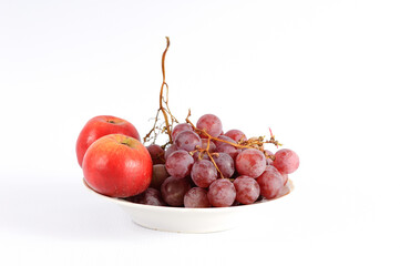 Assorted apple with grapes on a white background