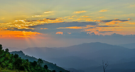 Fototapeta na wymiar Colorful sunset over the mountain hills Thailand