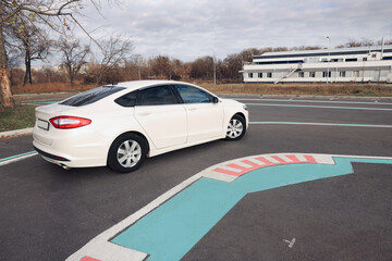 Modern car on test track with marking lines. Driving school
