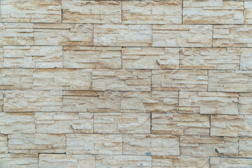Beige background made of artificial stone