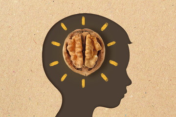 Child head silhouette with walnut - Walnuts are good for children's brain - 474703054