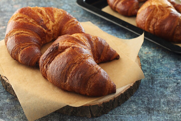 Freshly baked croissants on the table	