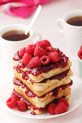 Sandwiches with peanut butter and raspberry jam