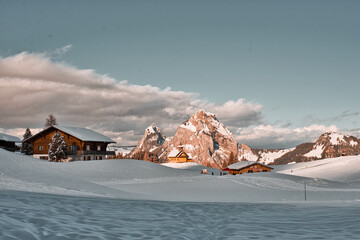 church in front of snow-covered mountains