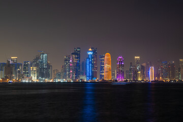 Fototapeta premium Doha city skyline illuminated at night. Qatar, Middle East