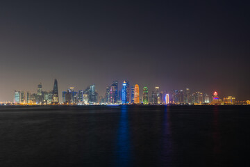 Fototapeta na wymiar Doha city skyline illuminated at night. Qatar, Middle East