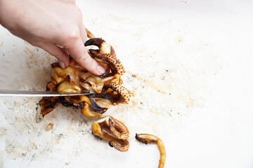 Sliced ​​grilled squid on a white chopping board,seafood
