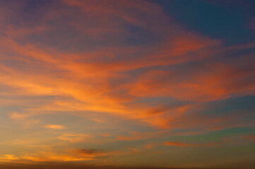 Naklejka na ściany i meble Dramatic red cloudscape at sunset. Natural background.