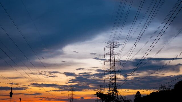 high power energy electricity pole for industrial and infrastructure grid connection of city and business at beautiful sunset time