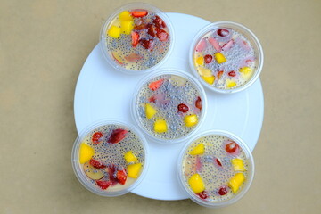 Colorful of several cups of fruit pudding on the table