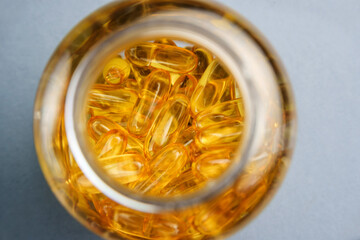 Omega-3 in a bottle. Fish oil capsules with selective focus.