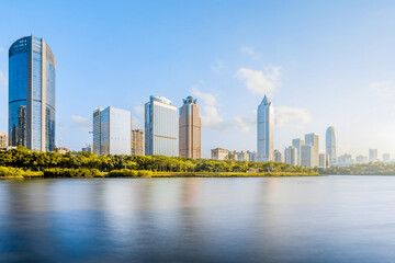 Obraz premium Sunny scenery of Wanlv Park and International Trade CBD buildings in Haikou, Hainan, China