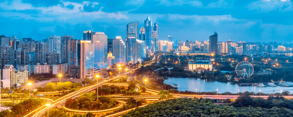 Plakat High-view night view of International Trade CBD and Binhai Overpass in Haikou, Hainan, China
