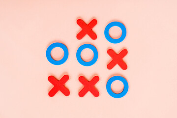 The game is tic-tac-toe on a pink background. The concept of choice