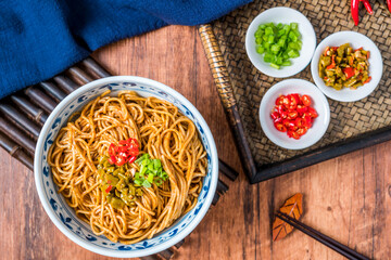Wuhan gourmet hot dry noodles placed on wooden table 