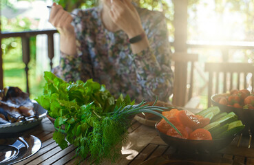 Woman eats fresh fruits and vegetables in the country.