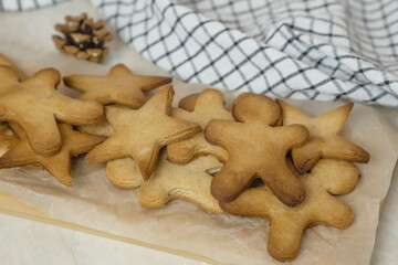 the process of making gingerbread men cookies , christmas cookies