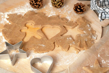 the process of making gingerbread men cookies , christmas cookies