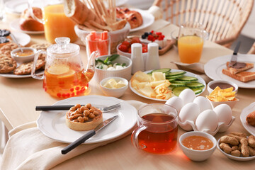 Dishes with different food on table indoors. Luxury brunch