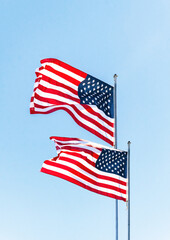 American flag against the backdrop of the blue sky