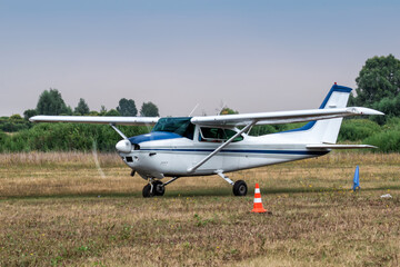 Fototapeta na wymiar Private single-engined piston-powered aircraft taxiing at the airfield