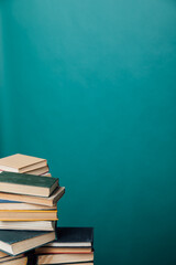 educational books for studying in the university library on a green background