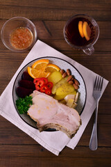 Vegetables, nuts and meat in a deep plate. Bowl.