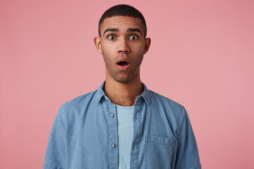 Obraz premium studio portrait of middle age middle eastern man wears blue shirt feels guilty, shocked with negative facial expression, isolated over pink background