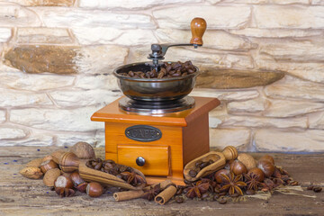 coffee grinder with coffee beans and spices - vintage style