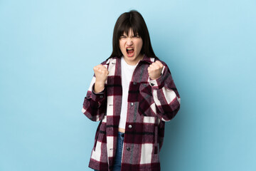 Teenager Ukrainian girl isolated on blue background frustrated by a bad situation