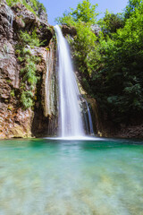 Fototapeta na wymiar the Ampola waterfall, in Val di Ledro, near the town of Storo, Trentino, Italy - August 2021.