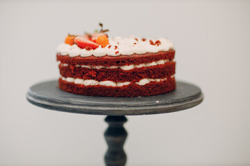 Pastry chef makes delicious red velvet cake. Cooking and decorating dessert.