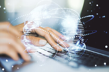 Abstract graphic digital world map with connections and hands typing on computer keyboard on...