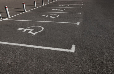 Car parking lot with wheelchair symbols outdoors