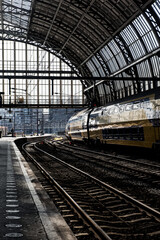 Fototapeta na wymiar Train station in Belgium. Waiting on the platform.