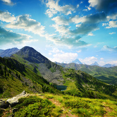Fototapeta na wymiar View on the mountain lake Lago di Chamole, Aosta valley, Italy. Summer landscape in the Alps.