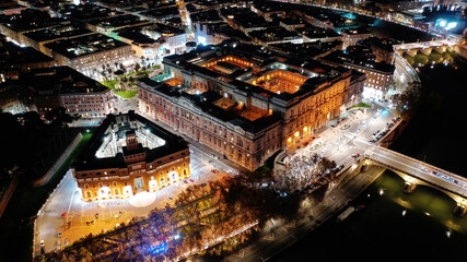 Aerial drone night shot from illuminated Cassation court Palace of justice, the highest supreme court of Italy next to famous piazza Cavour, Rome historic centre